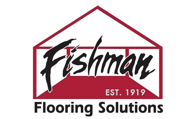 Logo for Fishman Flooring Solutions featuring a red outline of a house. Inside the house, the word "Fishman" is written in a black, expressive script font, with "EST. 1919" in small white text on a red background. Below the house graphic, the words "Flooring Solutions" are written in a bold, black sans-serif font.