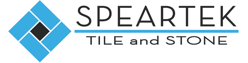 Logo for Speartek Tile and Stone featuring a blue diamond-shaped graphic on the left composed of four interlocking rectangles surrounding a small black center square. To the right, "SPEARTEK" is written in bold black letters above a blue horizontal line, with "TILE and STONE" written in a clean, black sans-serif font below the line.