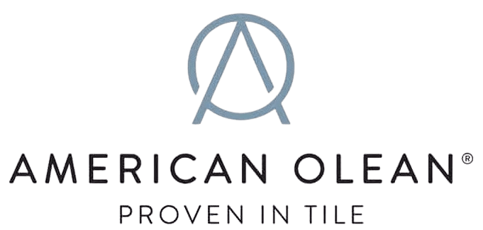 Logo for American Olean featuring a large, slate-blue monogram symbol consisting of a circle intertwined with an "A". Below the symbol, "AMERICAN OLEAN" is printed in a black, all-caps sans-serif font, followed by the slogan "PROVEN IN TILE" in a smaller, thinner black font.